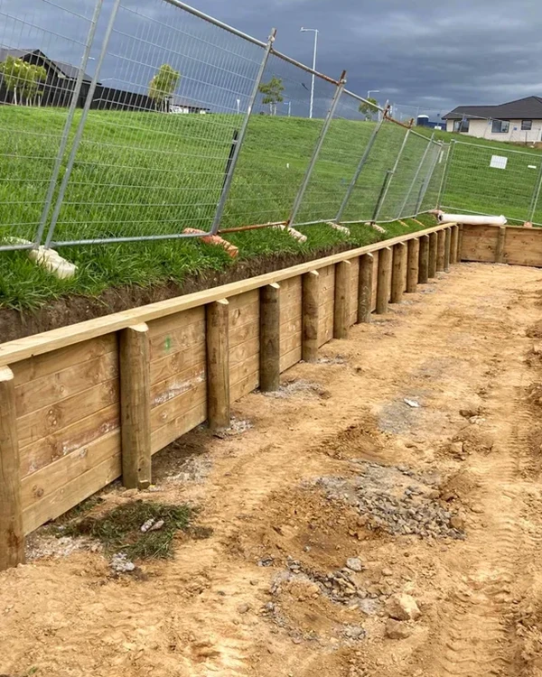 Low retaining wall built by Brix Construction in Tauranga suburban development